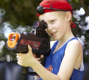 Young Boy Playing Laser Tag